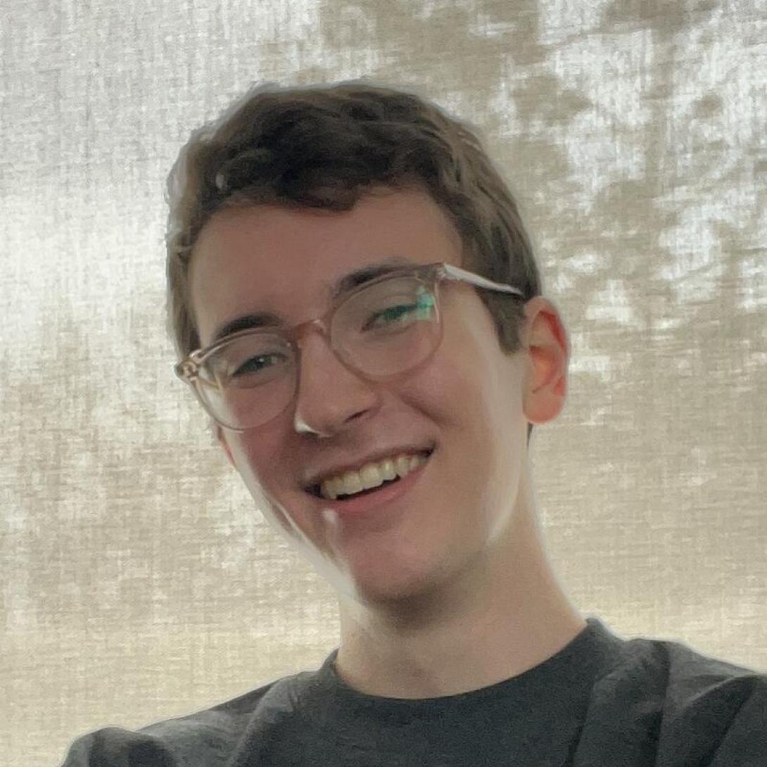 headshot of William Archacki, wearing glasses and smiling